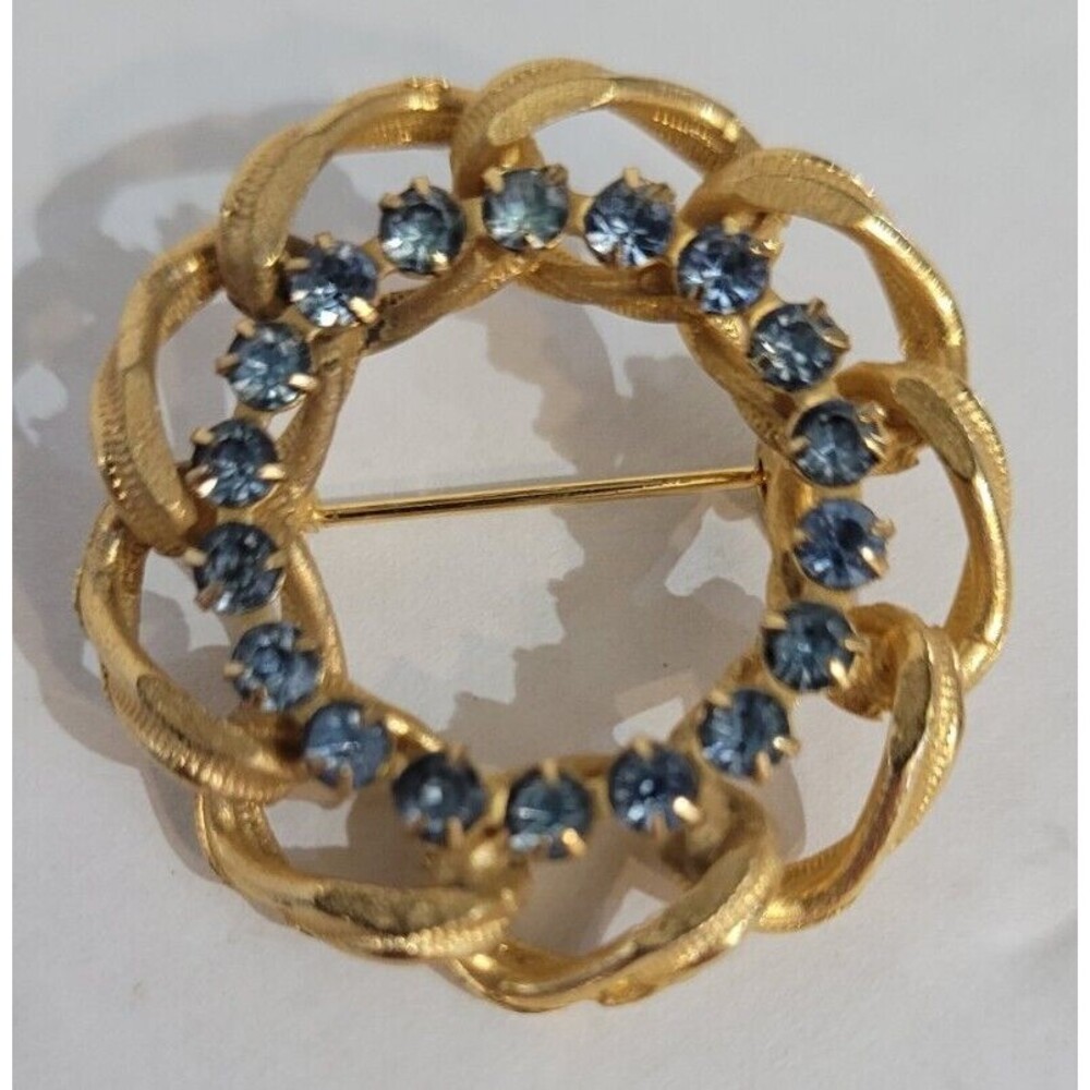 Vintage Blue Round Rhinestone Crystal Gold Tone Diamond Cut Swirl Brooch Pin